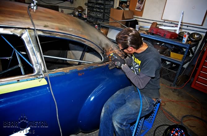 Johnny at work on the Oldsmobile.